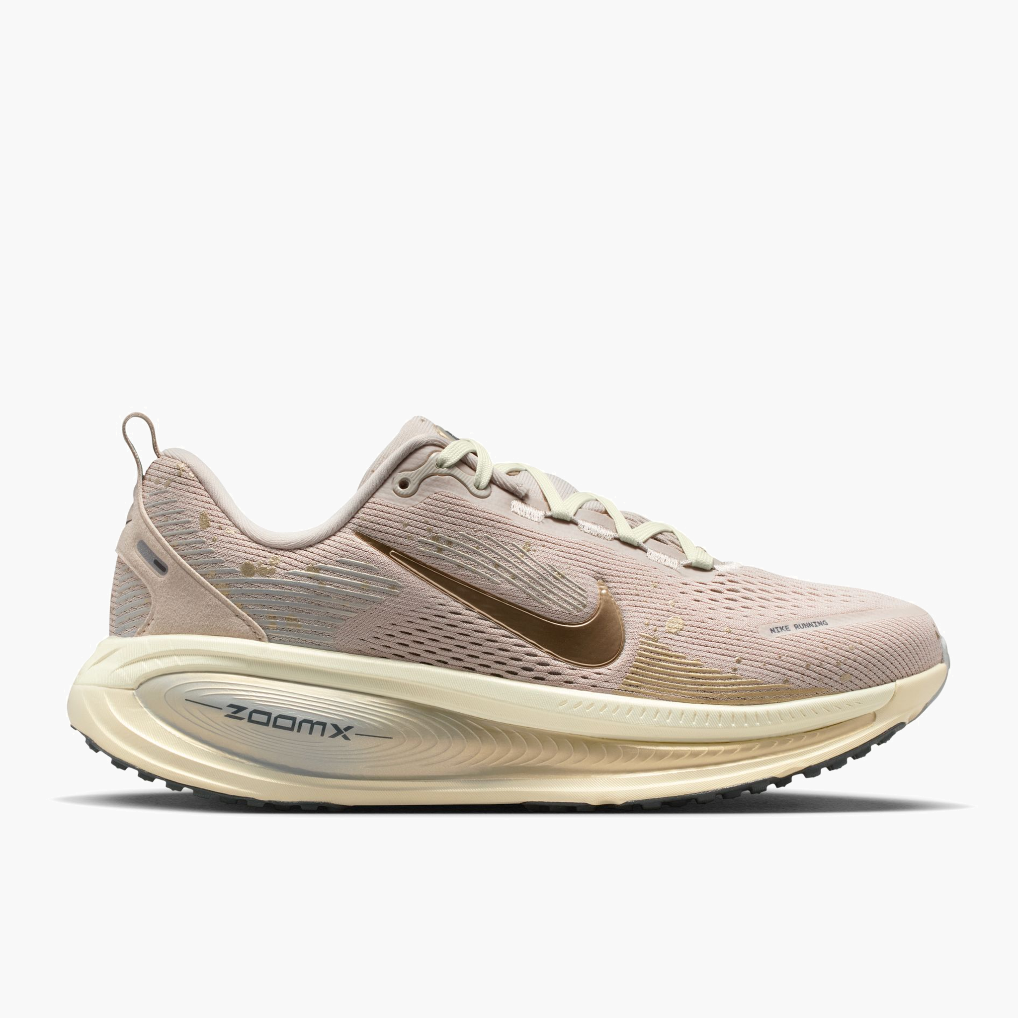 Lateral angle shot of Women's Vomero 18 in Cream Ii / Mtlc Gold Grain-Coconut Milk