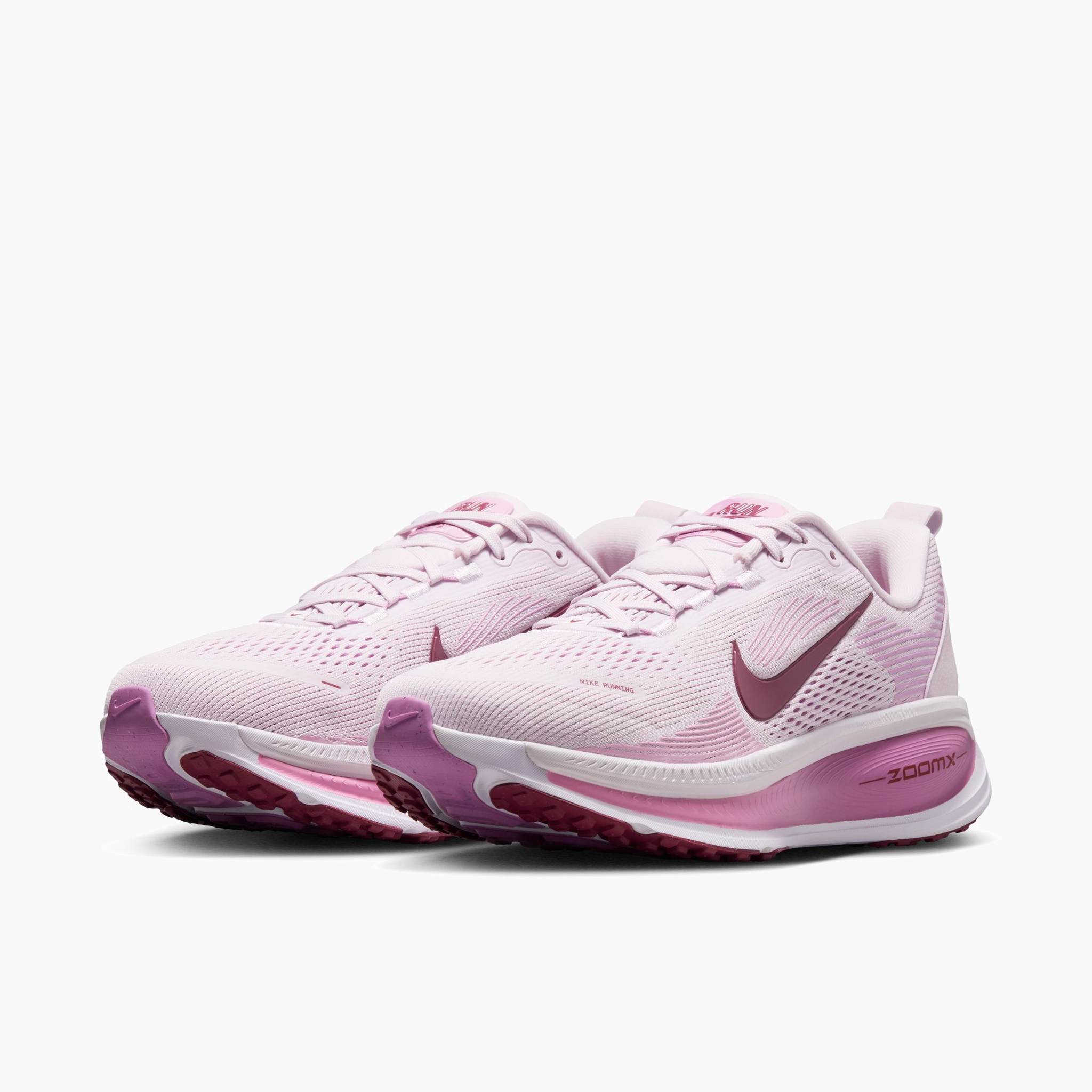 3/4 angle shot of Women's Vomero 18 in Bleached Lilac / Pink Smoke-Lt Magenta