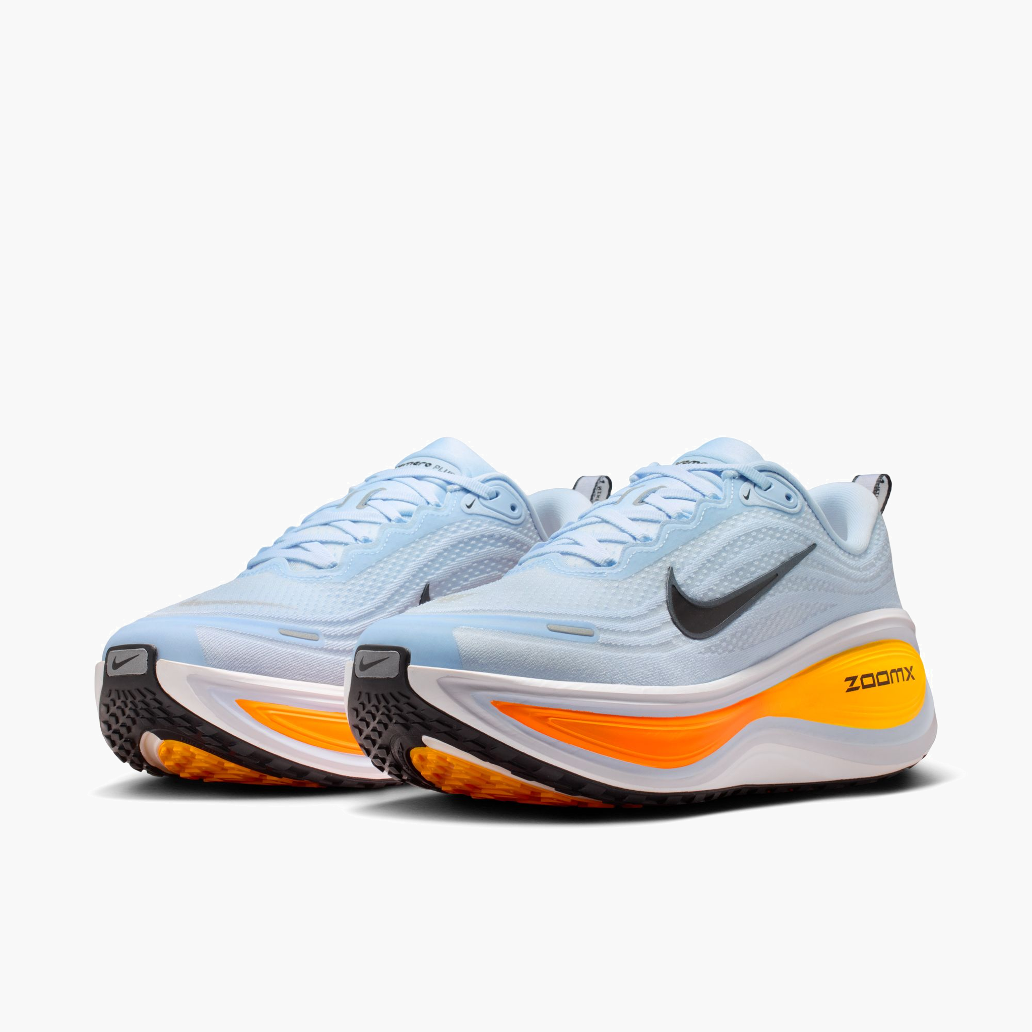 3/4 angle shot of Men's Vomero Plus in Hydrogen Blue / Black-White-Total Orange