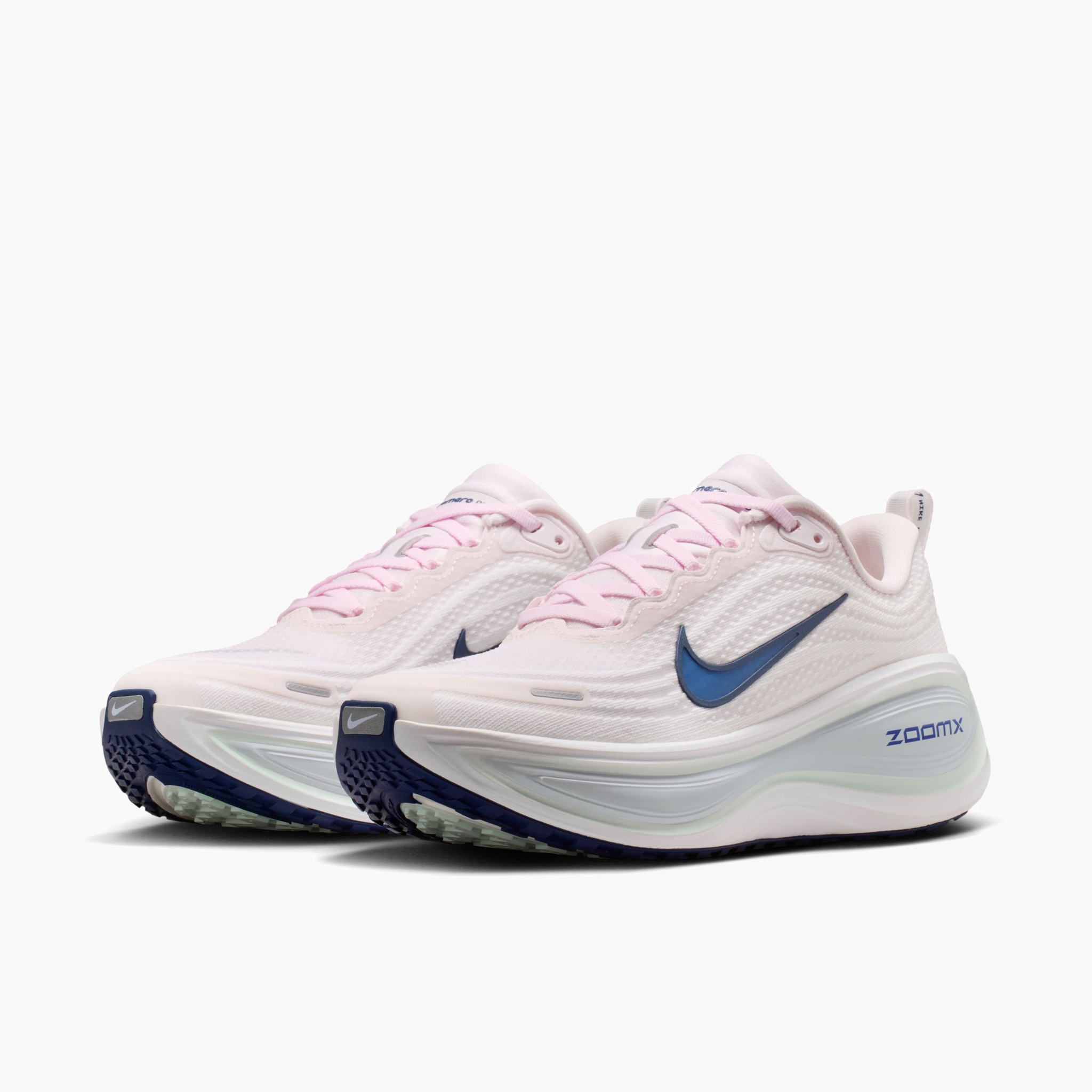 3/4 angle shot of Women's Vomero Plus in Pearl Pink / Midnight Navy-White