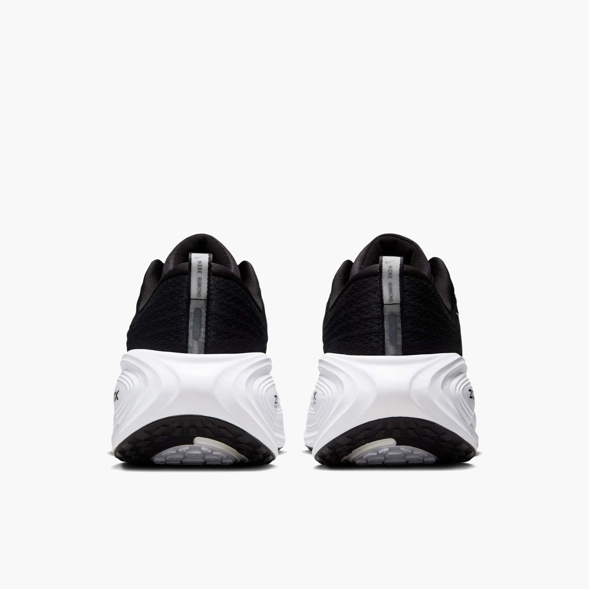 Heel angle shot of Men's Vomero Plus in Black / White-Cool Grey