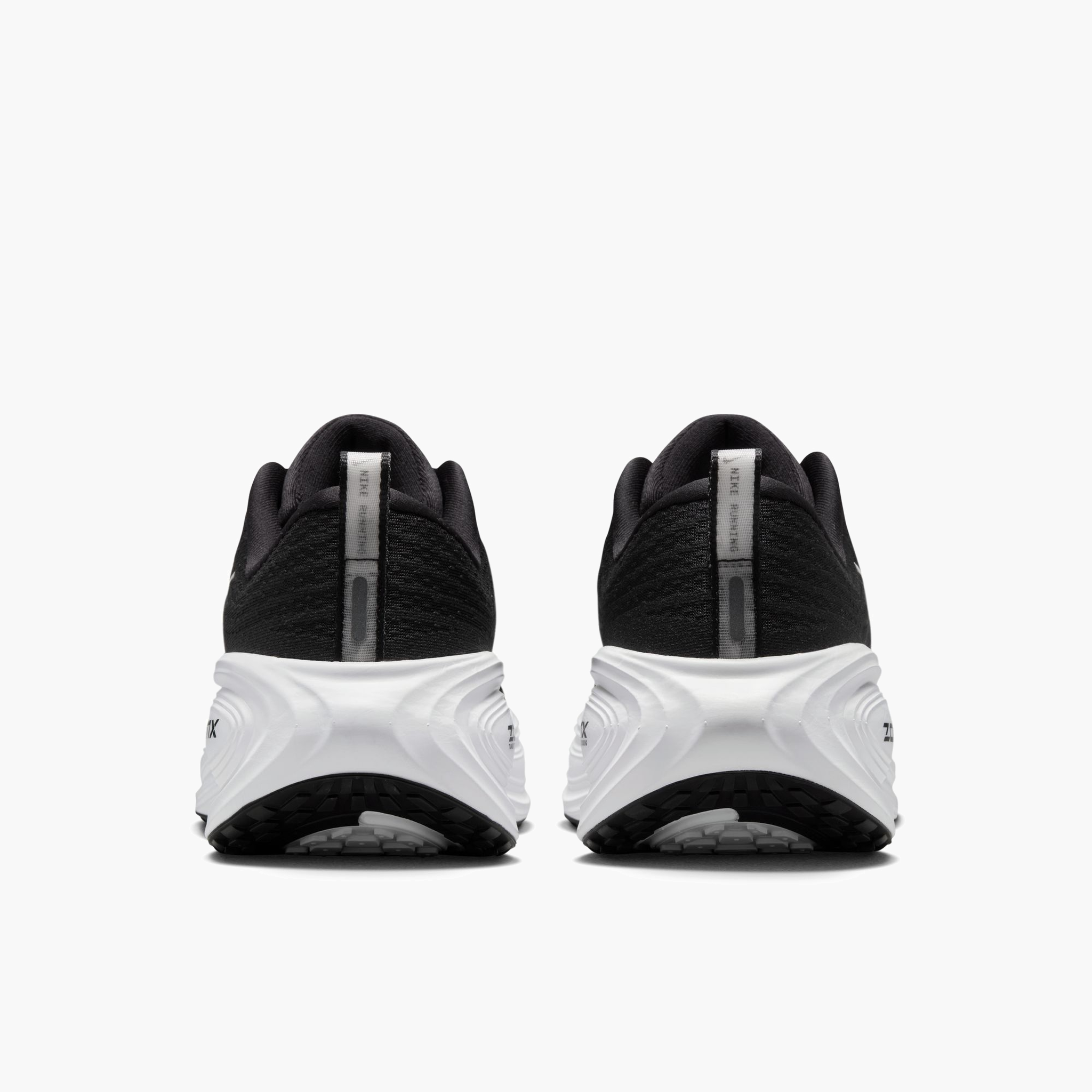 Heel angle shot of Women's Vomero Plus in Black / White-Cool Grey-Mtlc Dark Grey