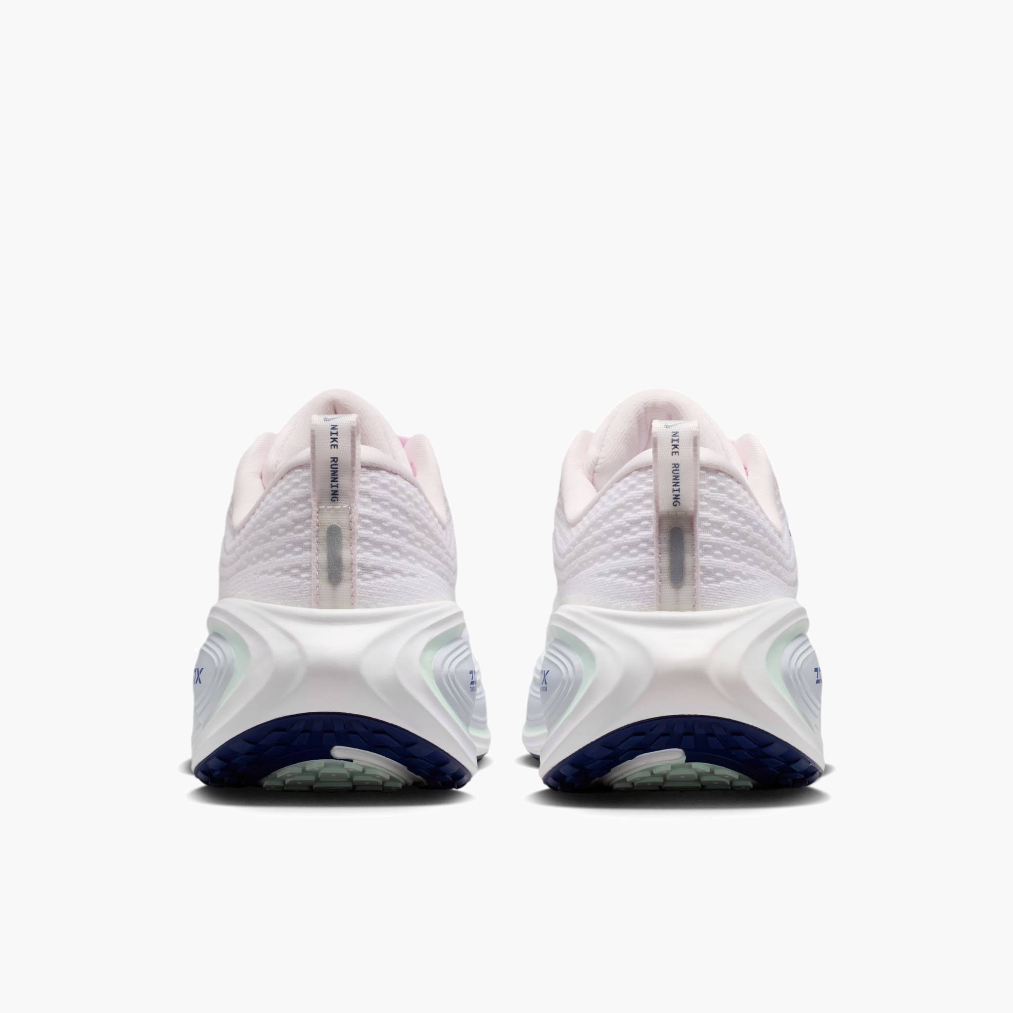 Heel angle shot of Women's Vomero Plus in Pearl Pink / Midnight Navy-White