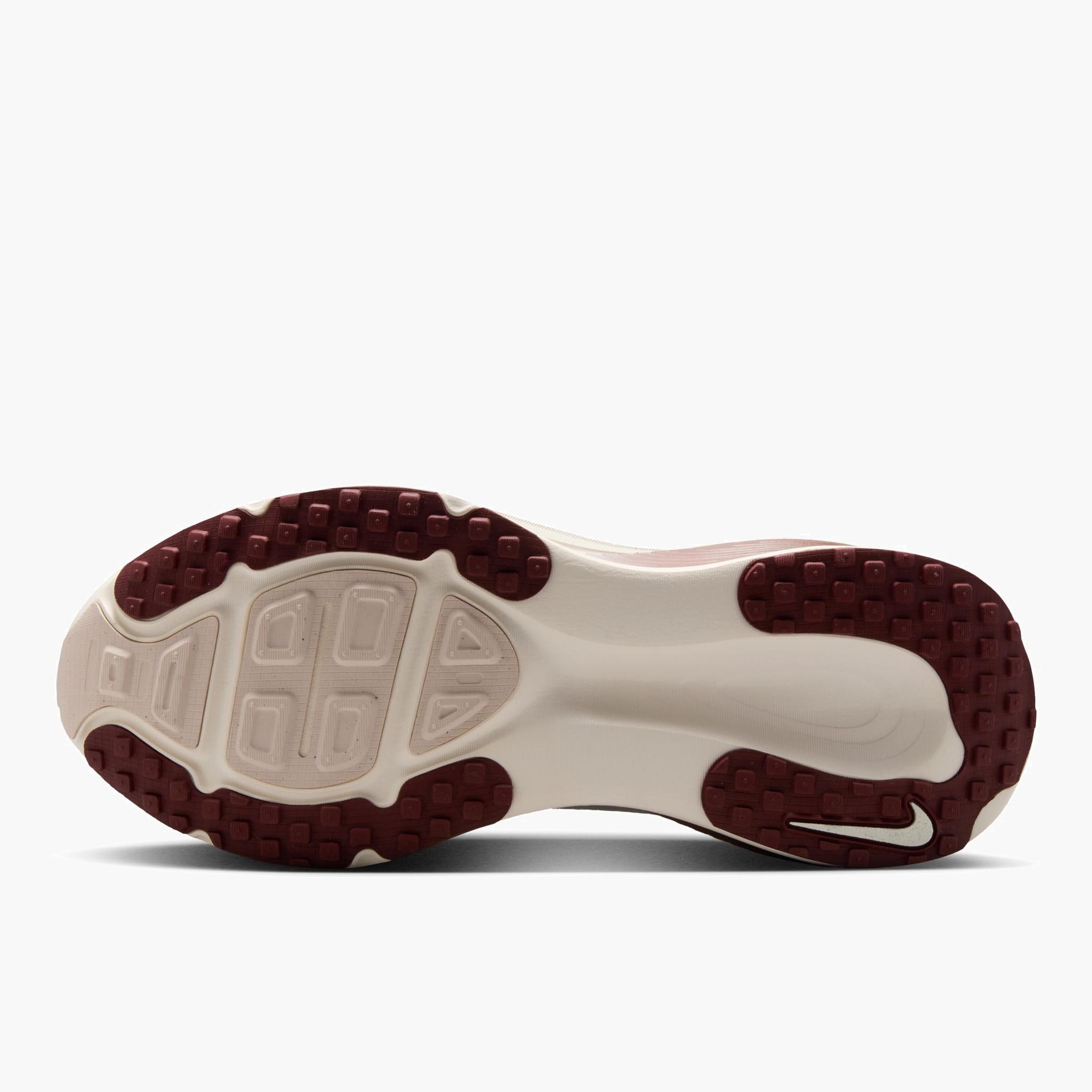 Sole angle shot of Women's Vomero 18 in Pale Ivory / Dark Team Red-Red Sepia