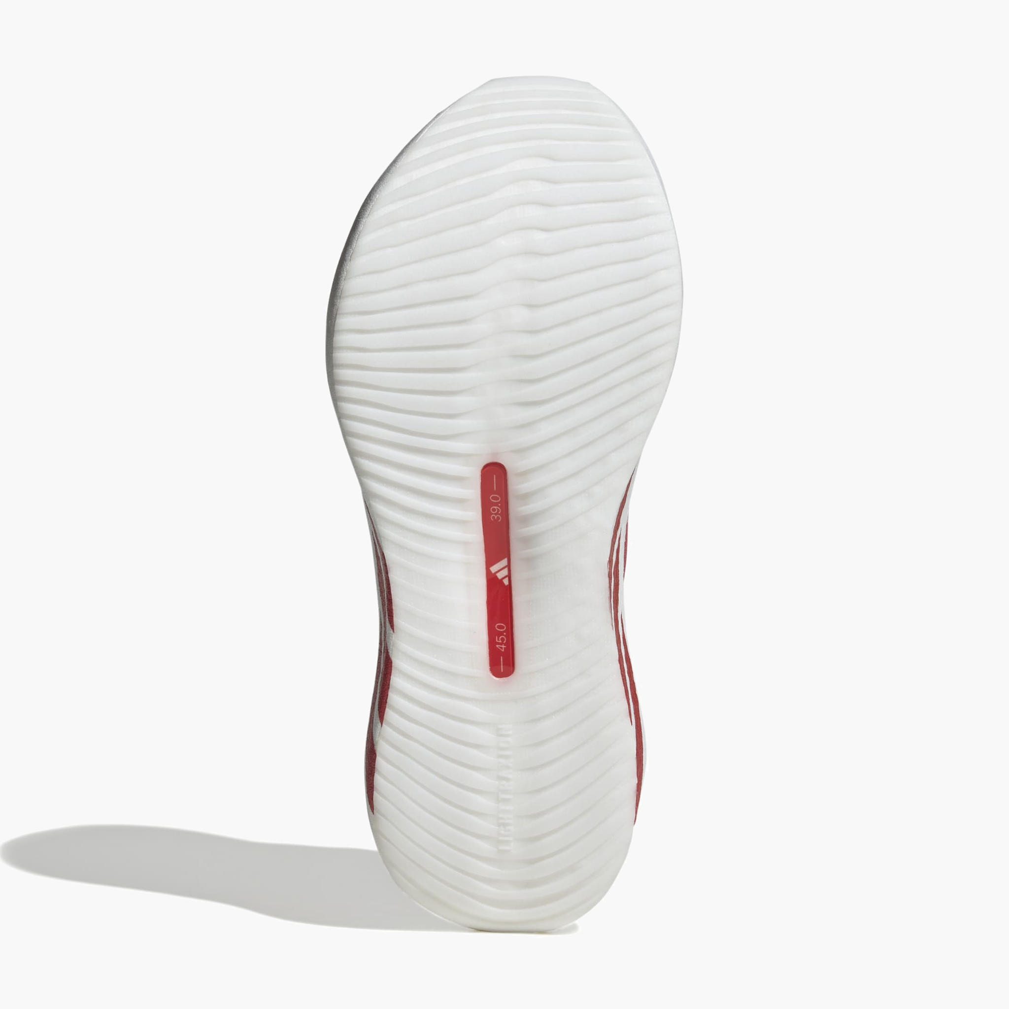 Sole angle shot of Women's Hyperboost Edge in Ftwr White / Pure Ruby / Zero Met.