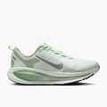 Lateral angle shot of Women's Vomero 18 in Barely Green / Metallic Silver-Steam
