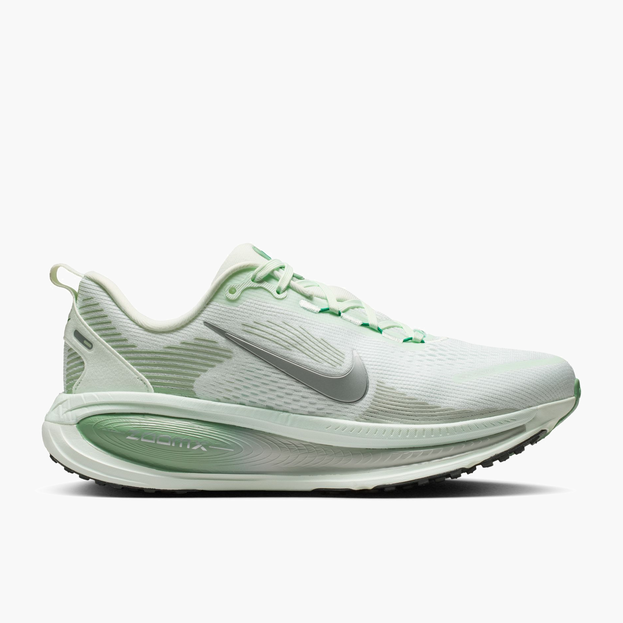 Lateral angle shot of Women's Vomero 18 in Barely Green / Metallic Silver-Steam