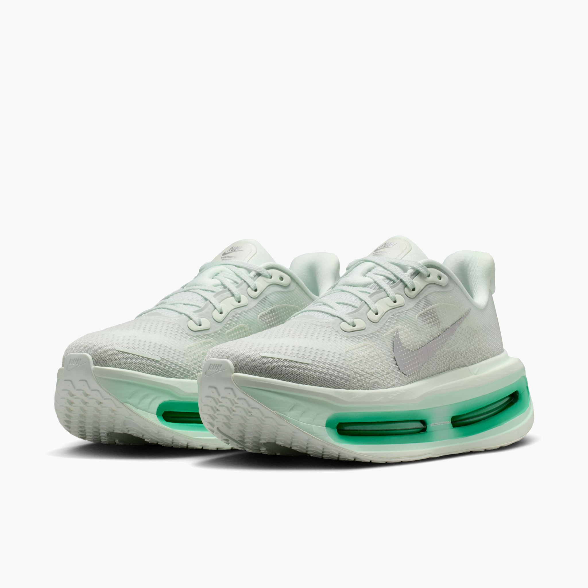 3/4 angle shot of Women's Vomero Premium in Barely Green / Metallic Silver