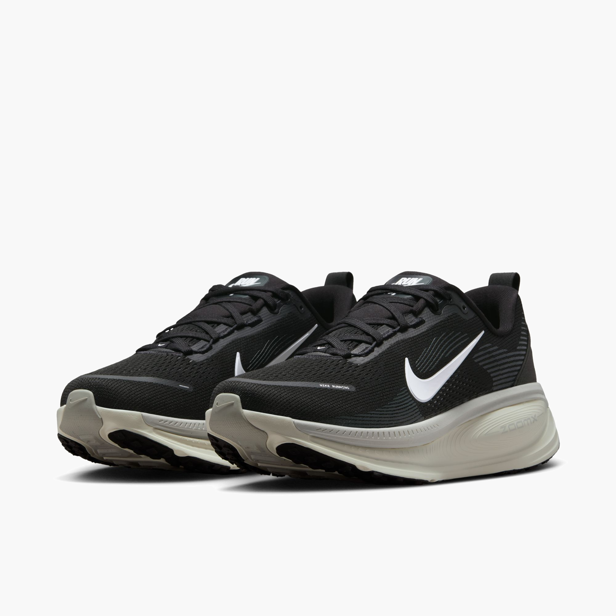3/4 angle shot of Men's Vomero 18 in Black / Summit White-Coconut Milk