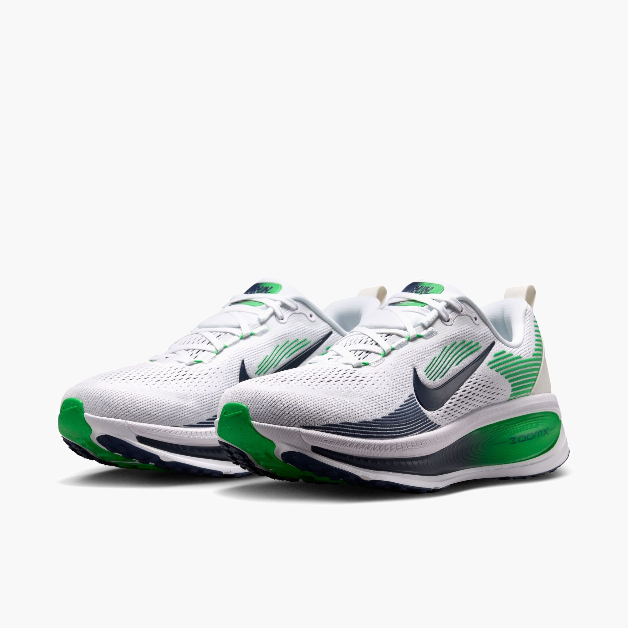 3/4 angle shot of Men's Vomero 18 in White / Midnight Navy-Green Spark