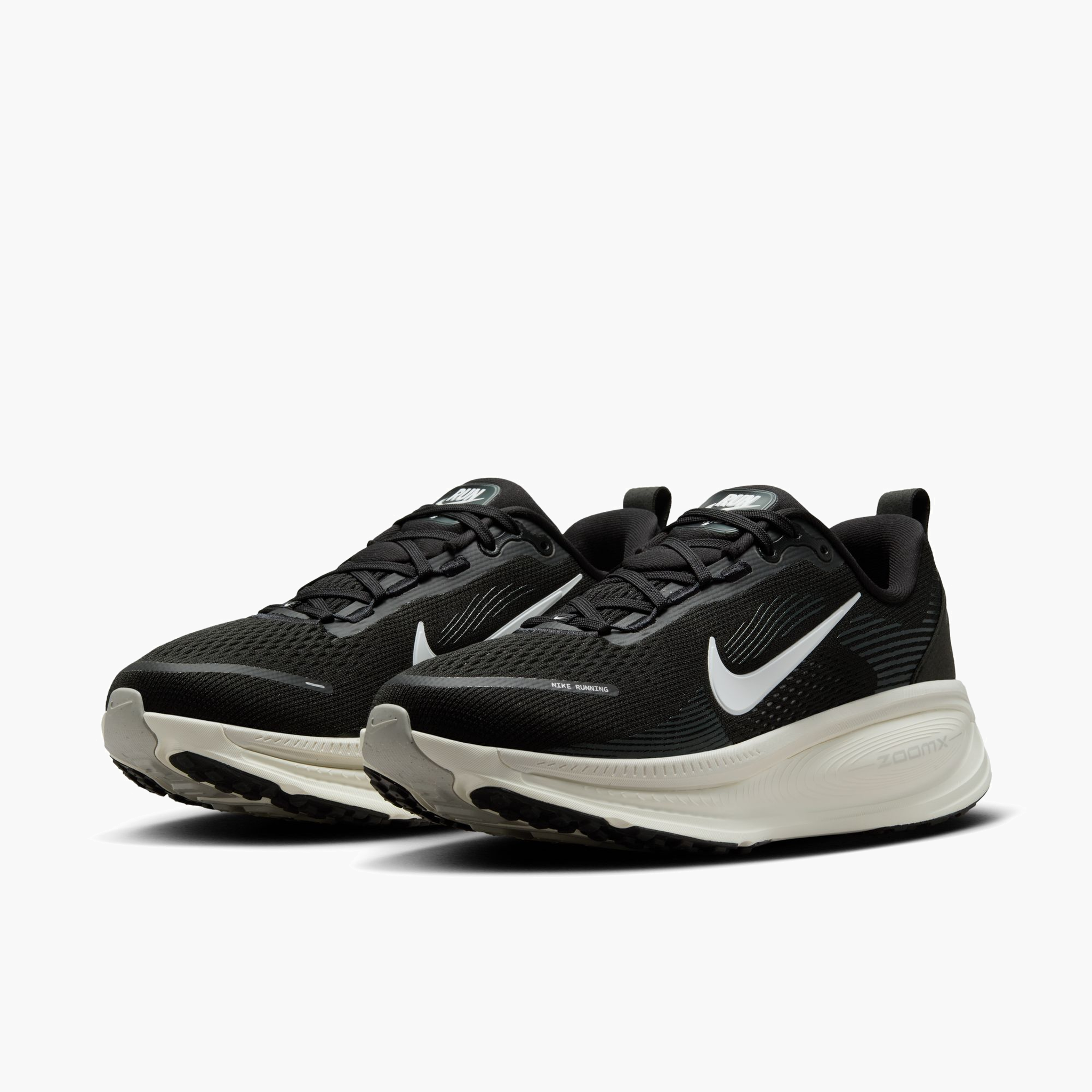 3/4 angle shot of Women's Vomero 18 in Black / Summit White-Coconut Milk