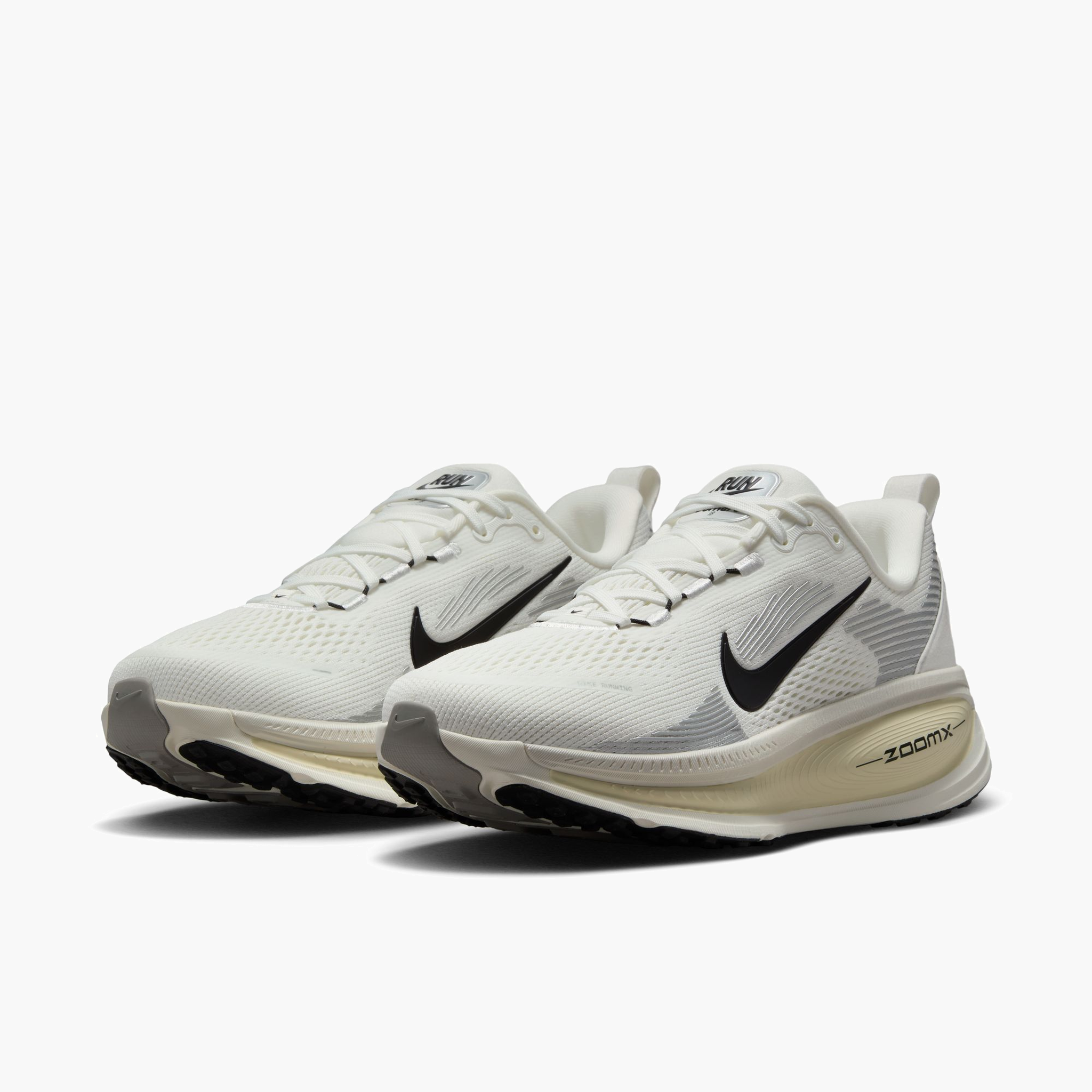 3/4 angle shot of Women's Vomero 18 in Summit White / Black-Coconut Milk