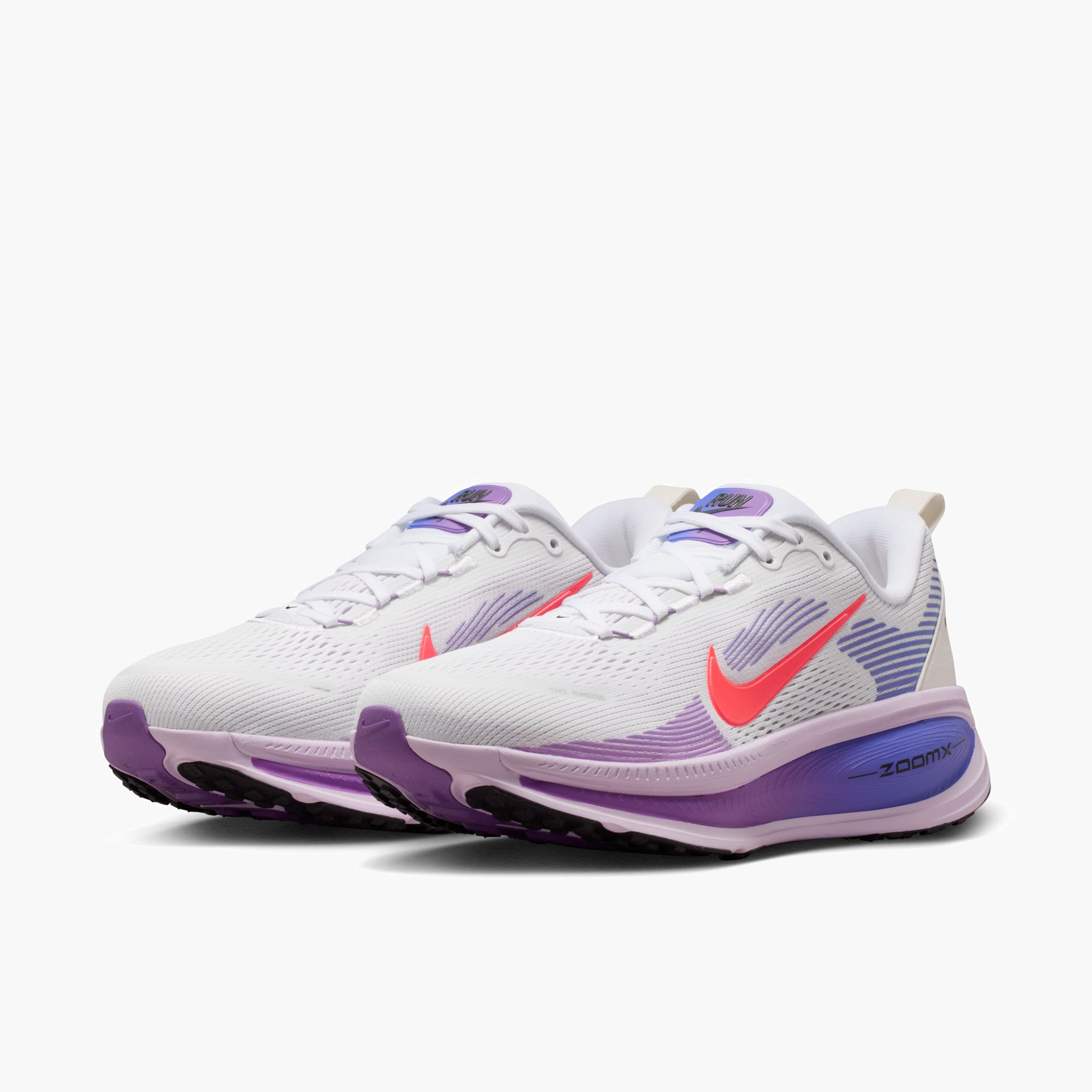 3/4 angle shot of Women's Vomero 18 in White / Hot Lava-Violet Mist-Sapph