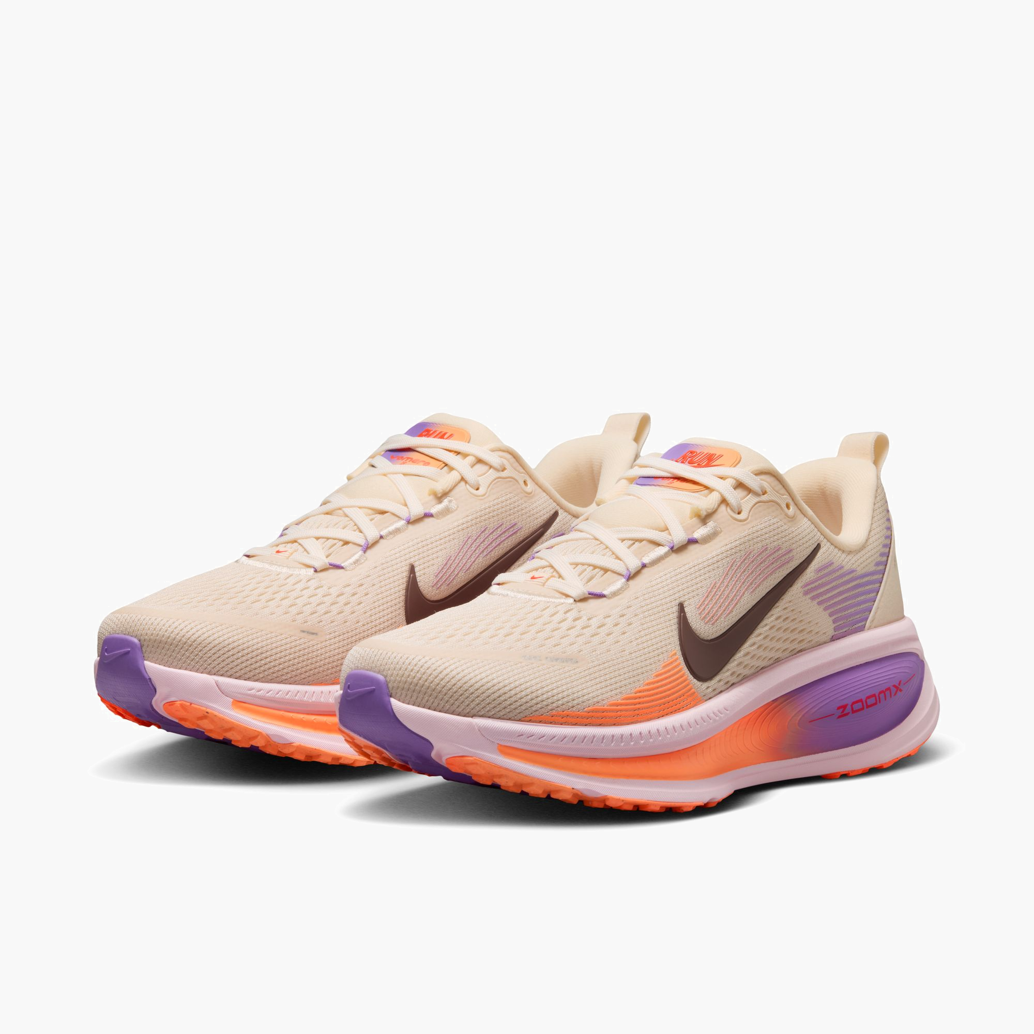 3/4 angle shot of Women's Vomero 18 in Chalk / Tattoo-Pink Foam-Bright Violet