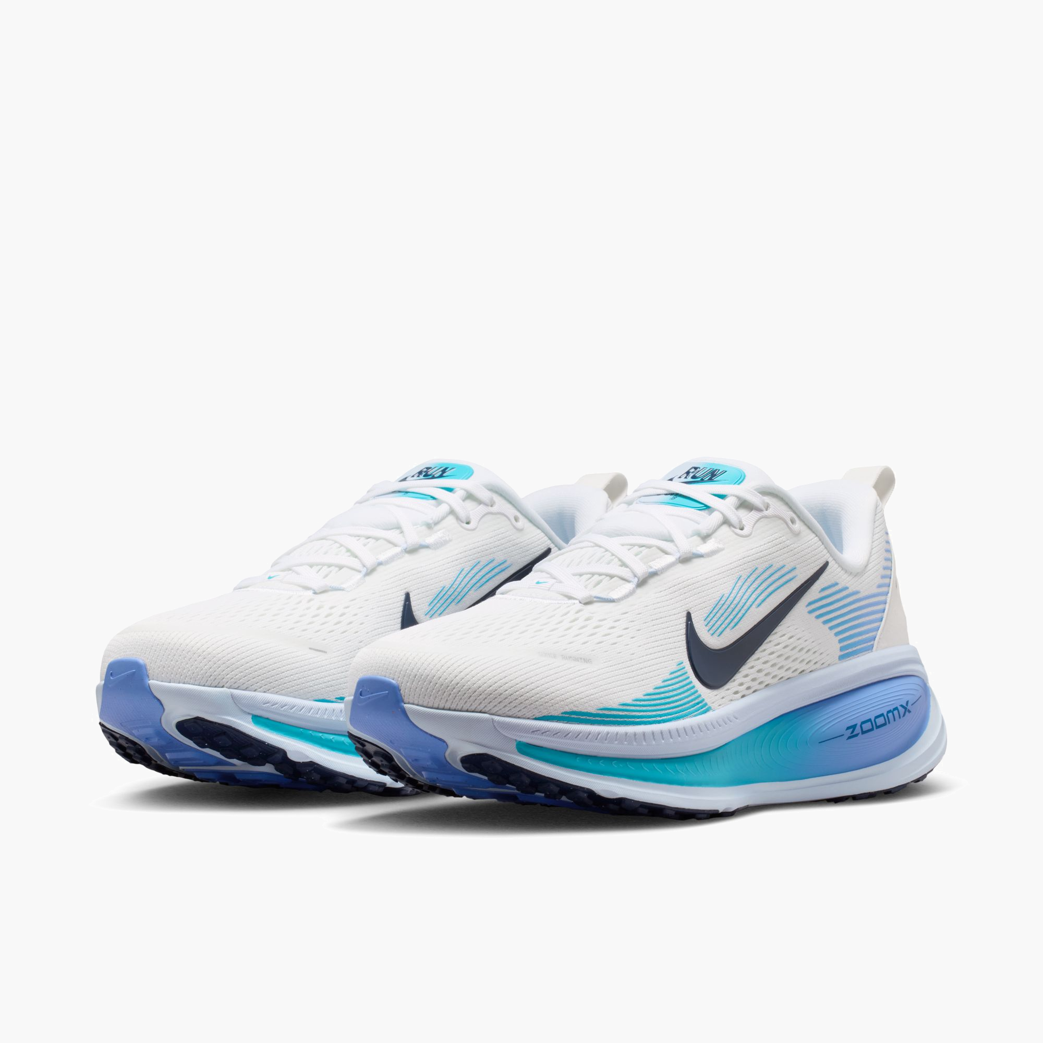 3/4 angle shot of Women's Vomero 18 in White / Midnight Navy-Blue Fury