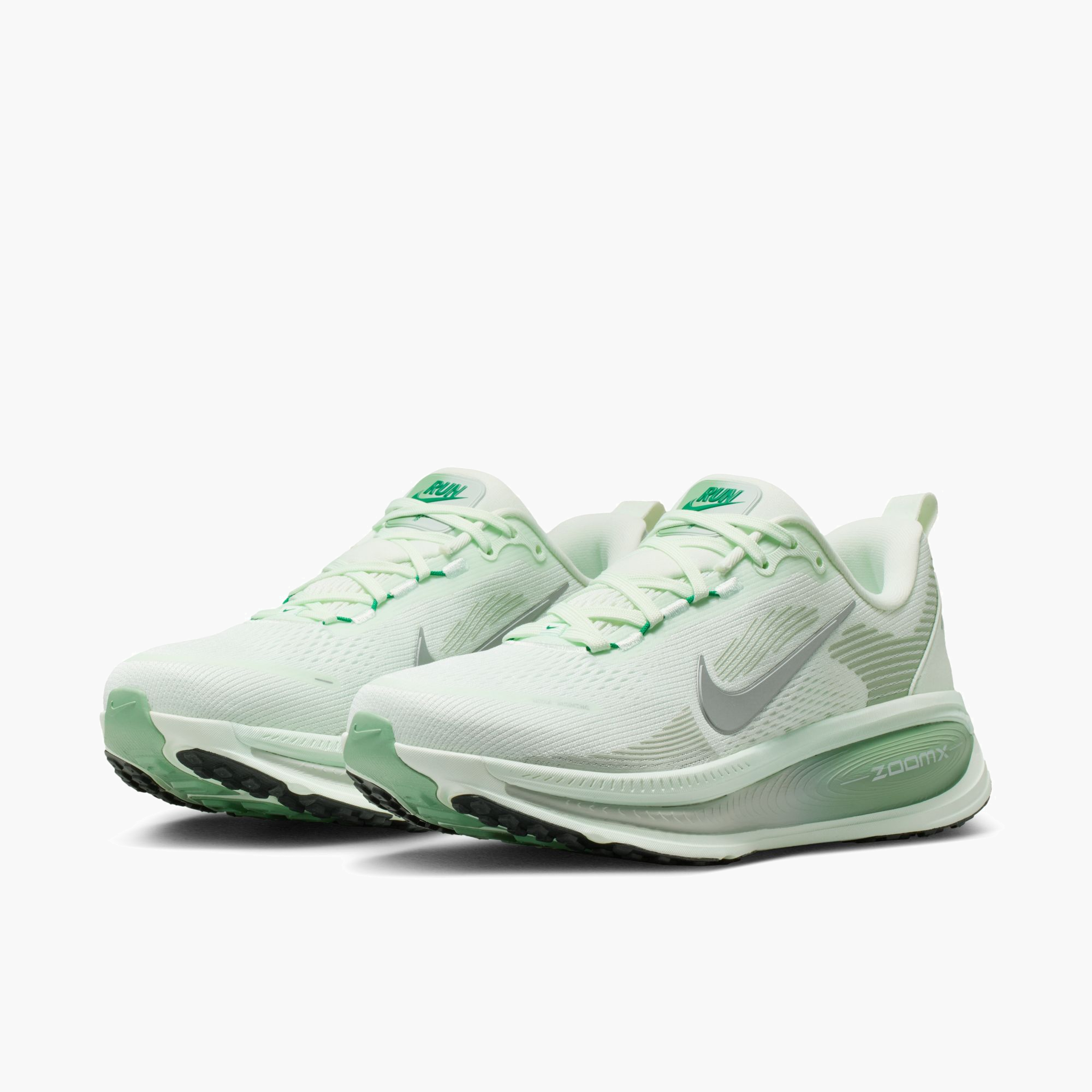 3/4 angle shot of Women's Vomero 18 in Barely Green / Metallic Silver-Steam
