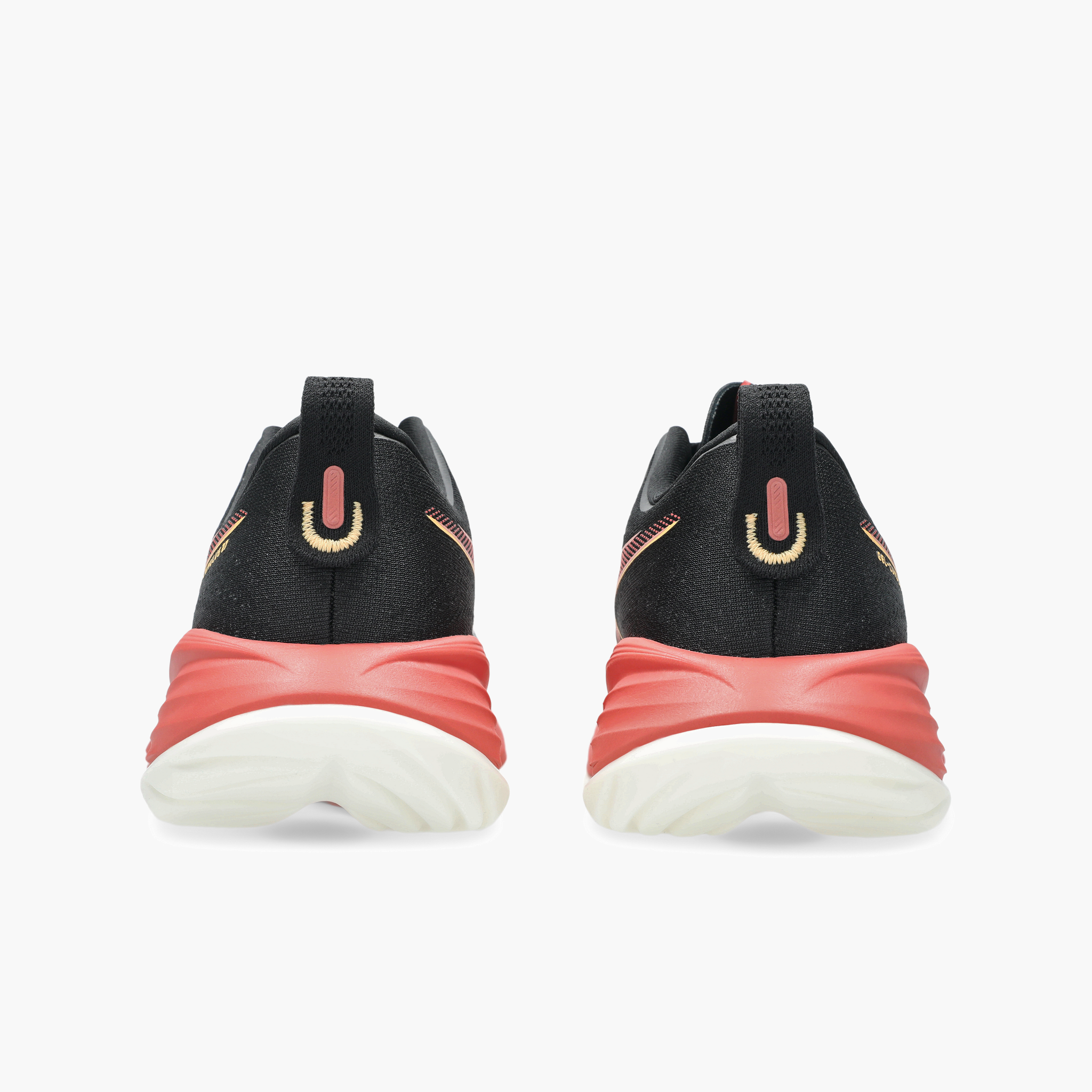 Heel angle shot of Women's Gel-Cumulus 27 in Black / Orange Glow