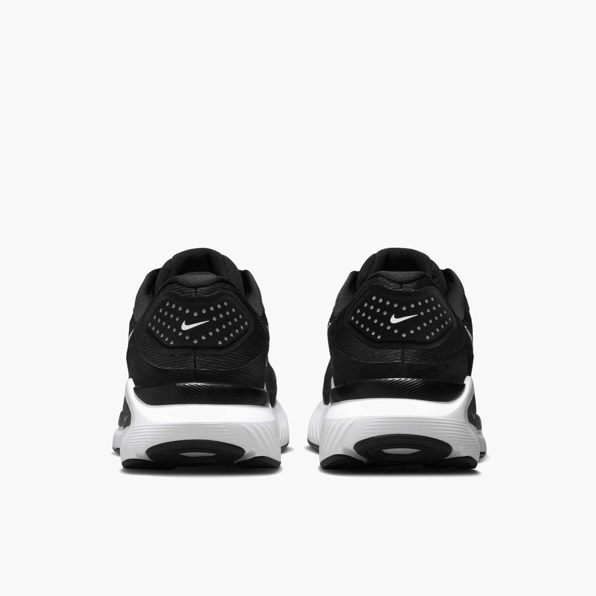Heel angle shot of Women's Structure 26 in Black / White-Cool Grey-Metallic Silver