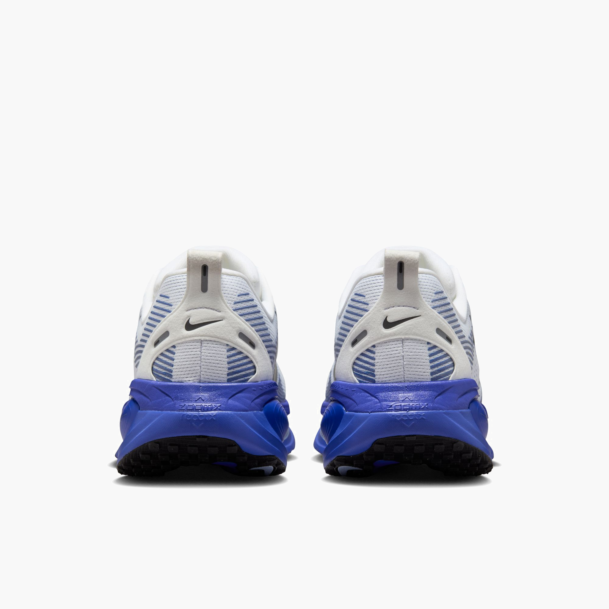 Heel angle shot of Men's Vomero 18 in White / Black-Blue Tint-Light Marine