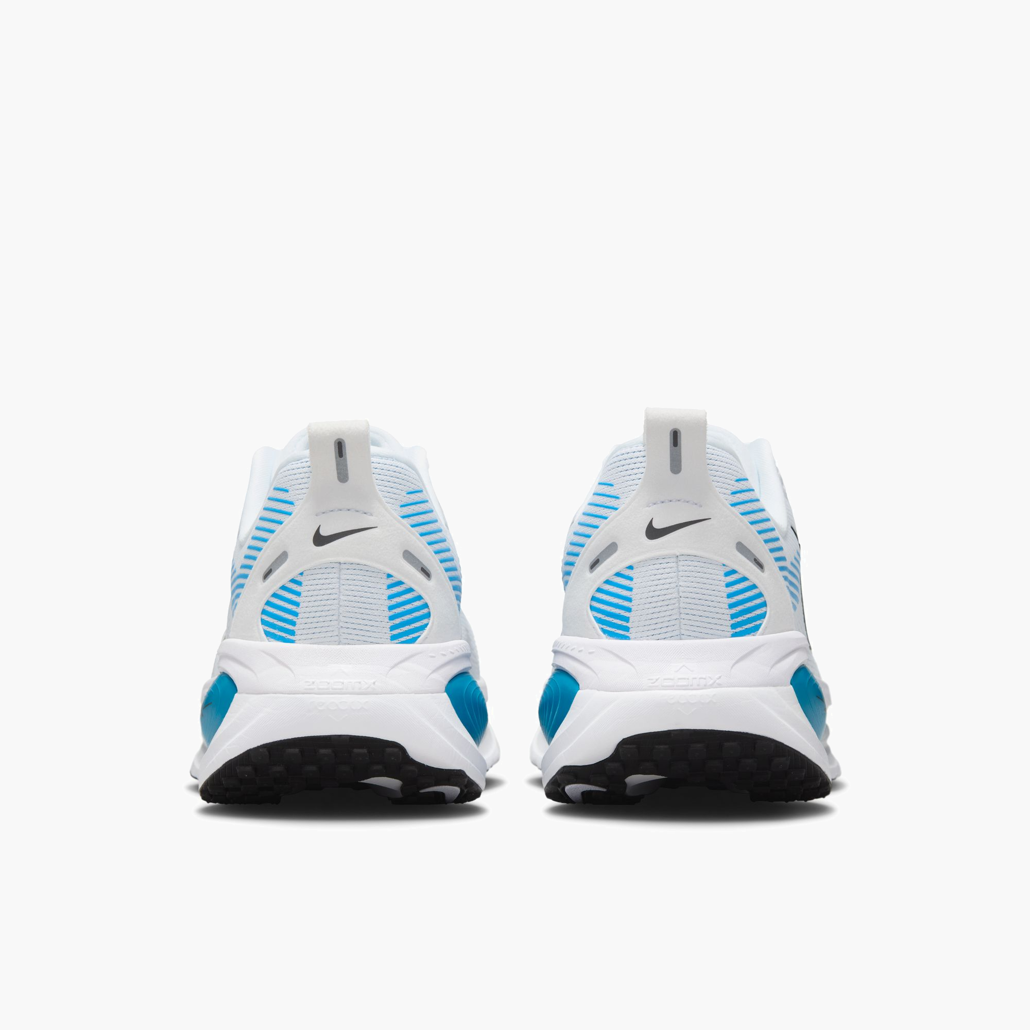 Heel angle shot of Men's Vomero 18 in White / Black-Blue Hero