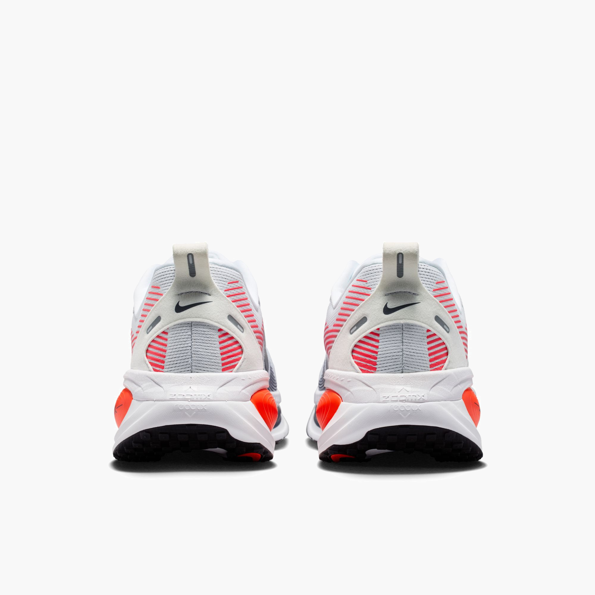 Heel angle shot of Men's Vomero 18 in White / Midnight Navy-Bright Crimson-Black