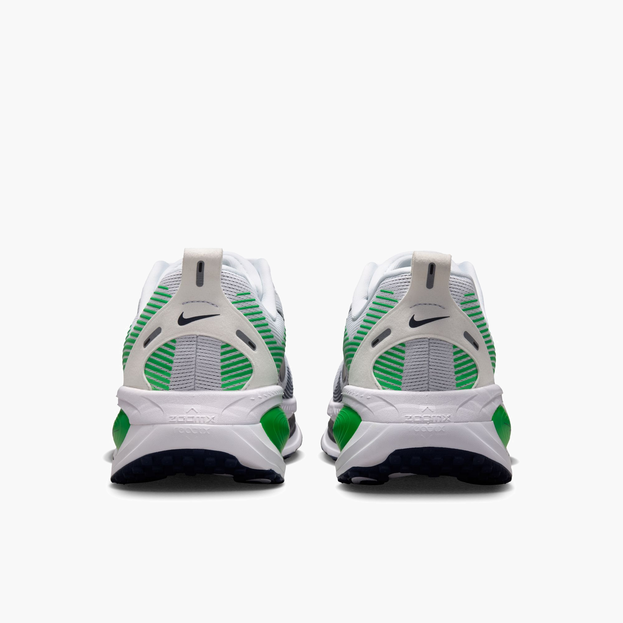 Heel angle shot of Men's Vomero 18 in White / Midnight Navy-Green Spark