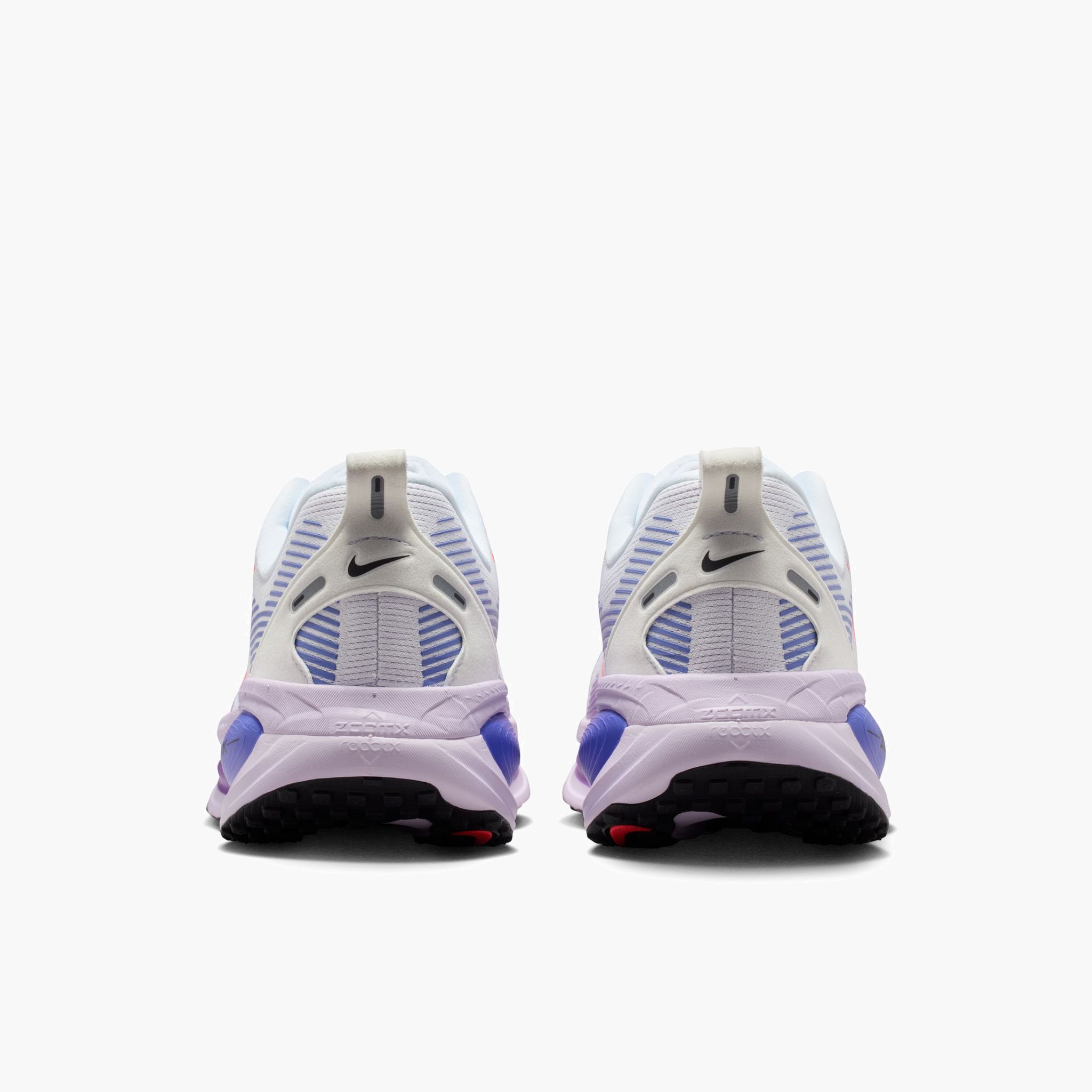 Heel angle shot of Women's Vomero 18 in White / Hot Lava-Violet Mist-Sapph