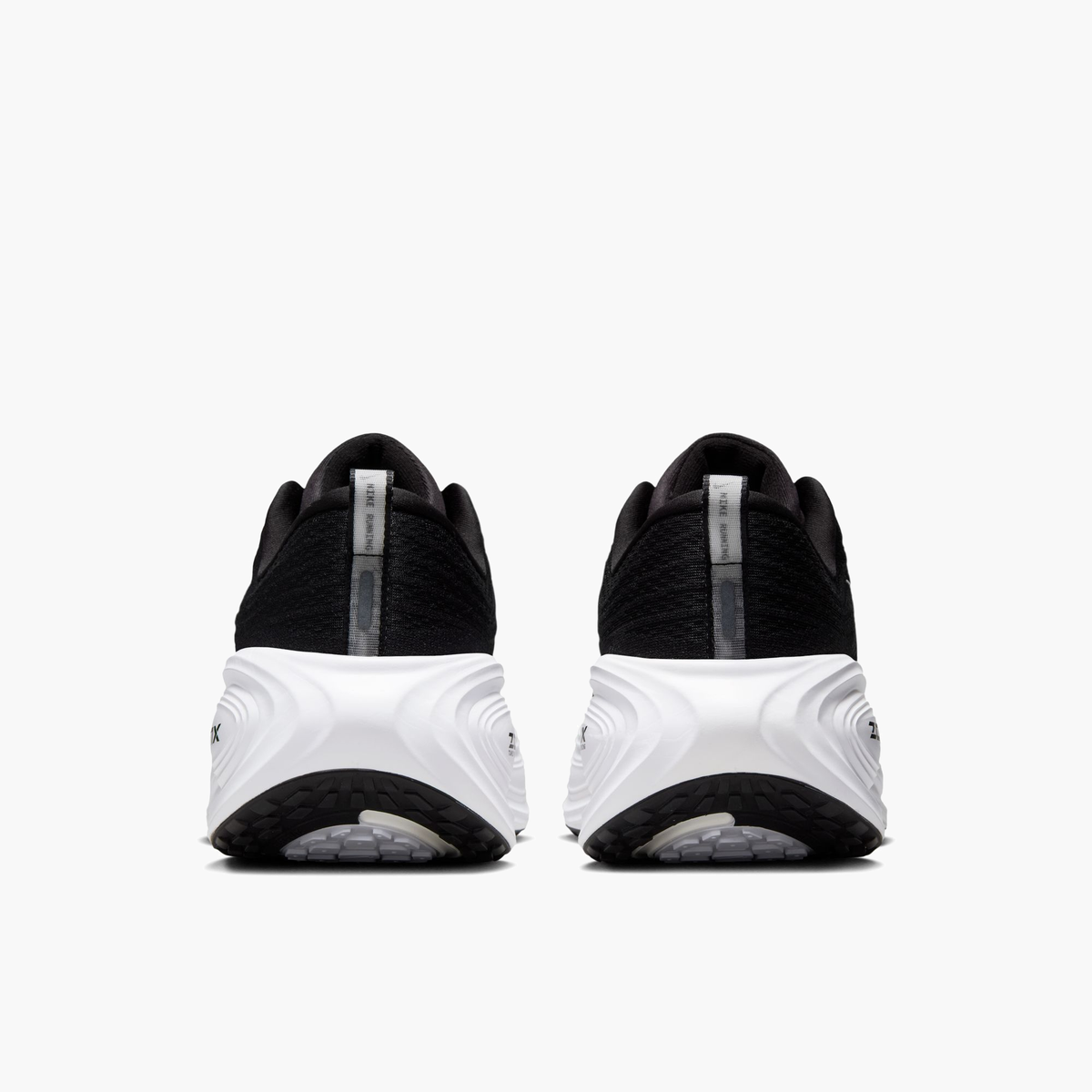 Heel angle shot of Men's Vomero Plus in Black / White-Cool Grey