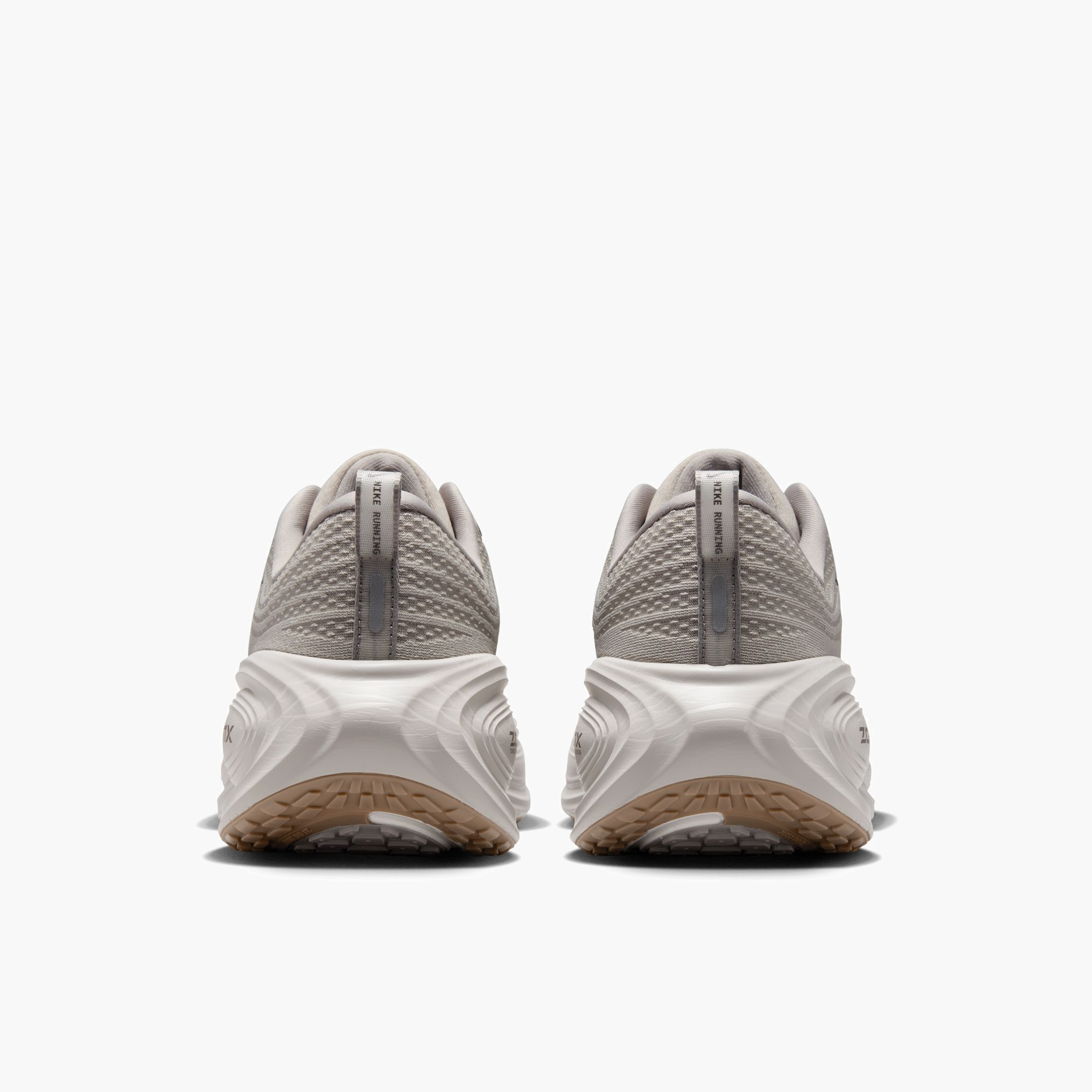 Heel angle shot of Men's Vomero Plus in College Grey / Medium Ash-Lt Iron Ore
