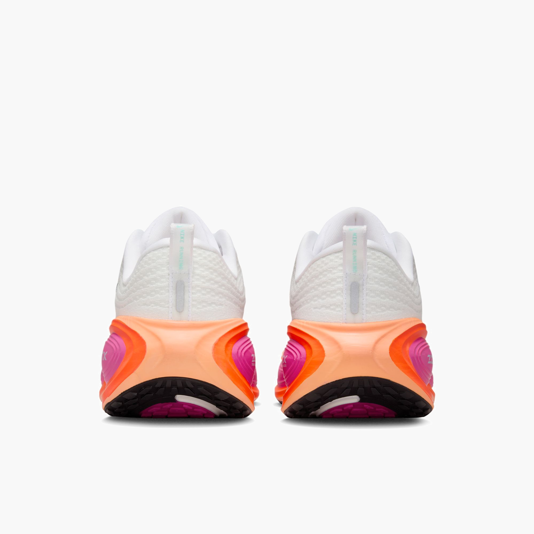 Heel angle shot of Women's Vomero Plus in White / Black-Fire Pink-Hyper Crimson