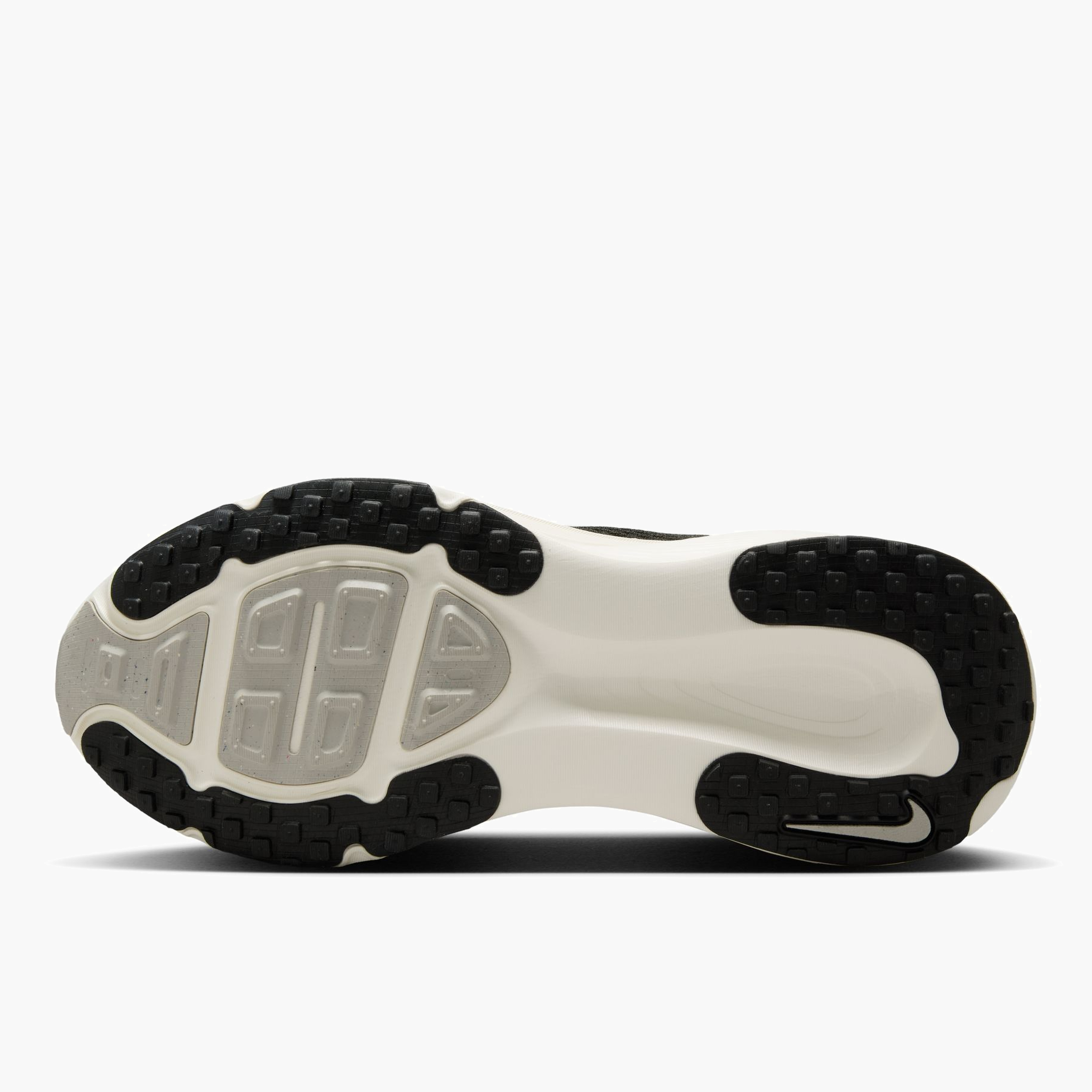 Sole angle shot of Women's Vomero 18 in Black / Summit White-Coconut Milk