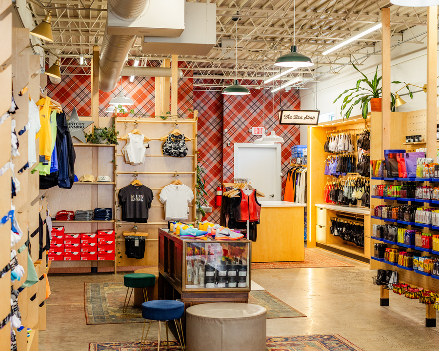 Interior of a store with clothing racks and shelves displaying various items.